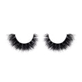 Pair of black false eyelashes on a white background