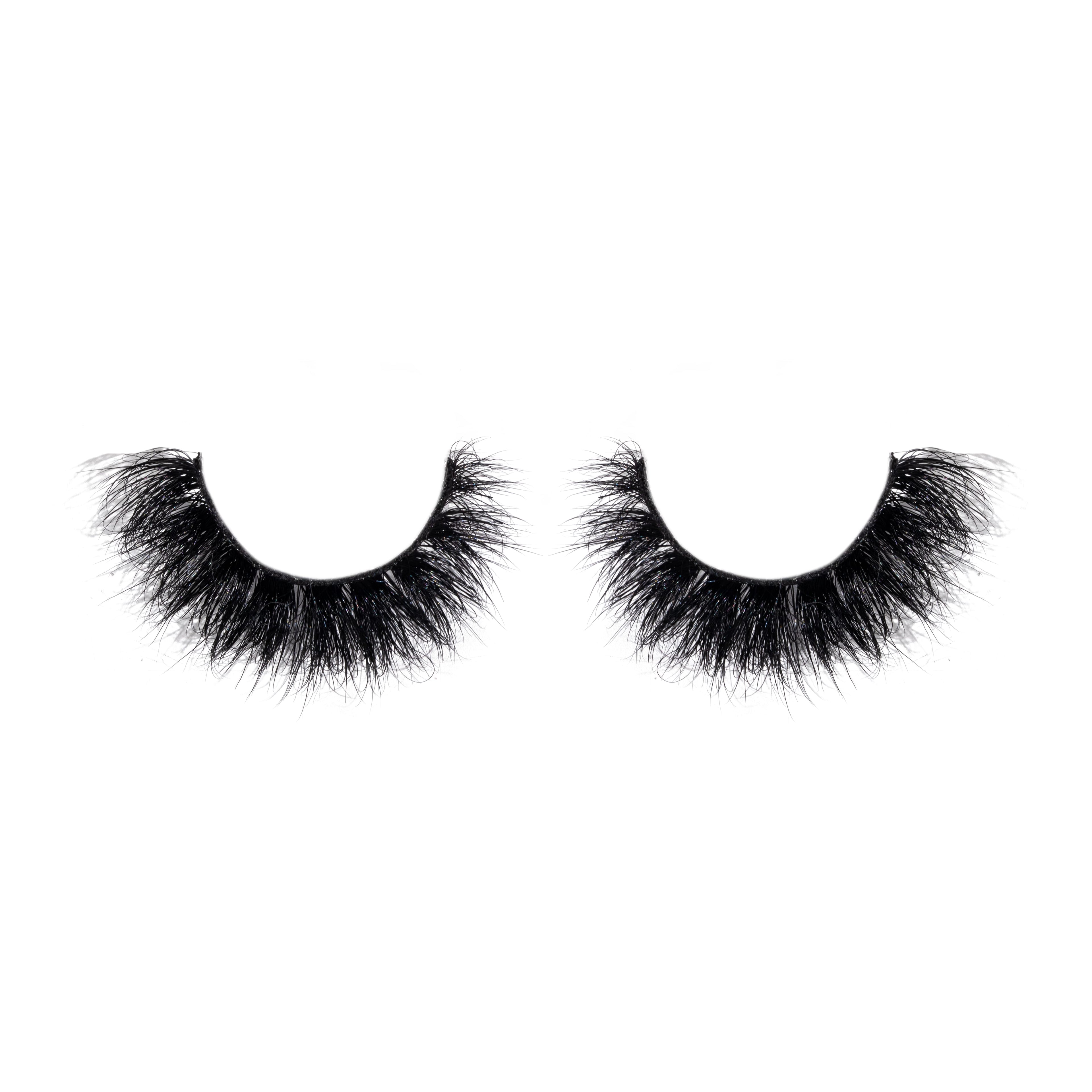 Pair of black false eyelashes on a white background