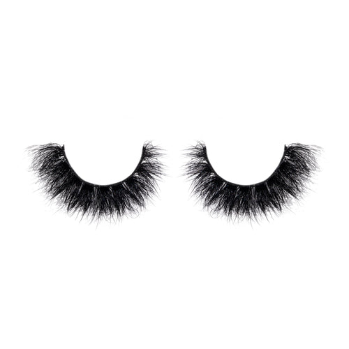 Pair of black false eyelashes on a white background