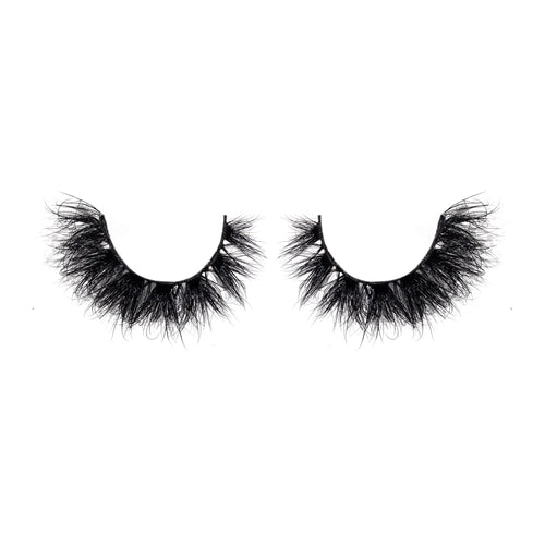 Pair of black false eyelashes on a white background