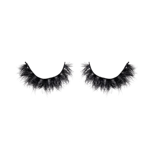 Pair of black false eyelashes on a white background