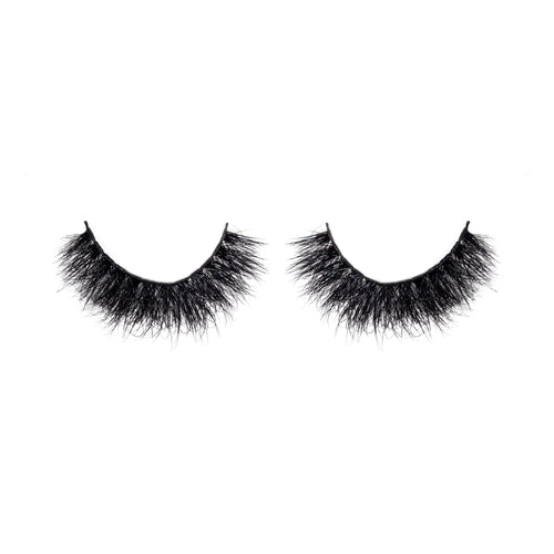 Pair of black false eyelashes on a white background