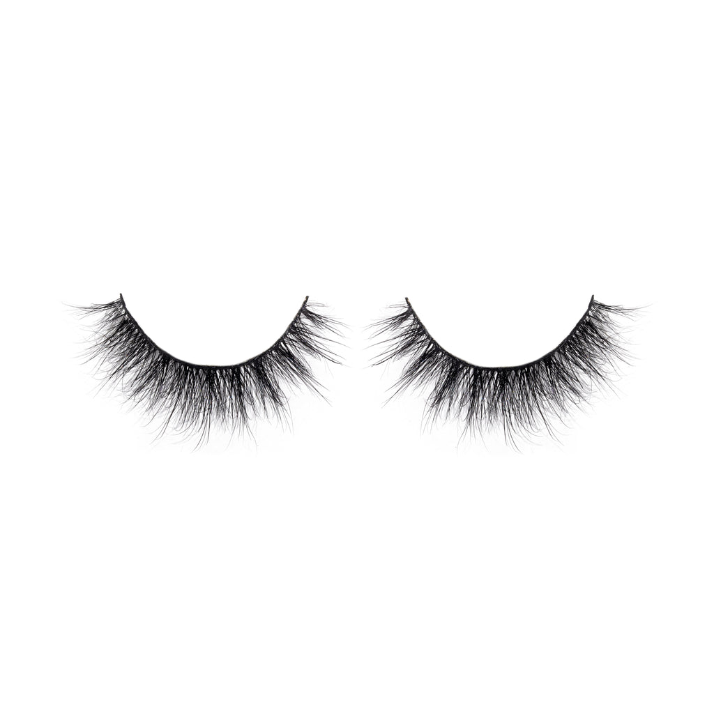 Pair of black false eyelashes on a white background