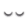 Pair of black false eyelashes on a white background