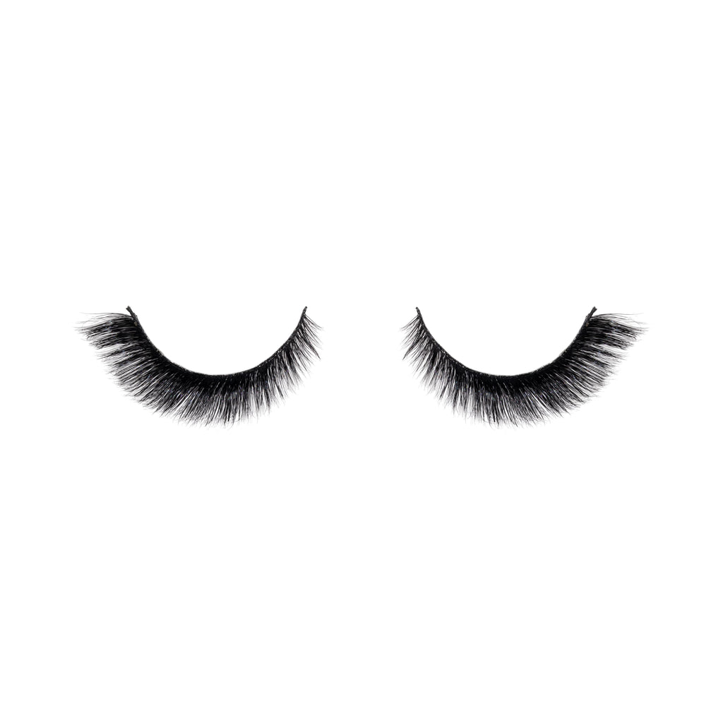 Pair of black false eyelashes on a white background