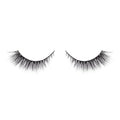 Pair of black false eyelashes on a white background
